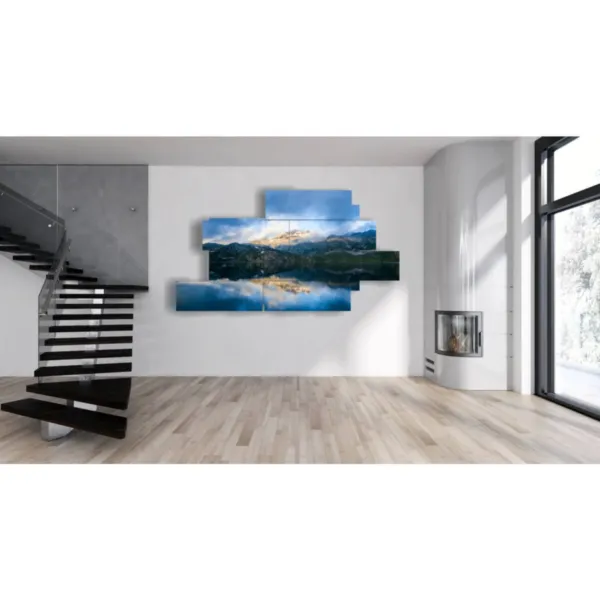 paintings of lake and mountain