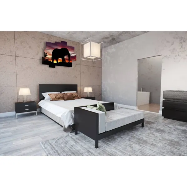 photo of an elephant at sunset