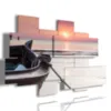 quadri con barche in un tramonto rosato